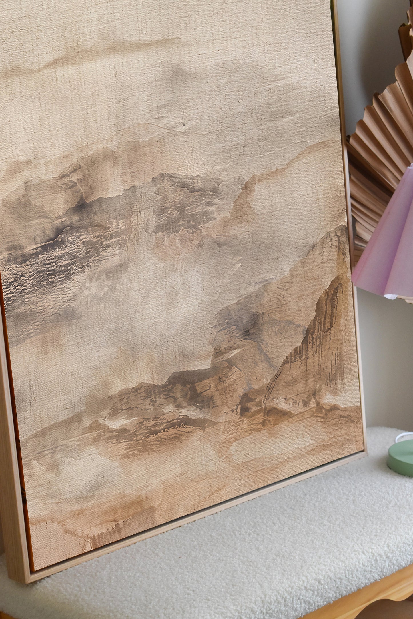 Neutral mountain landscape canvas displayed in a modern room